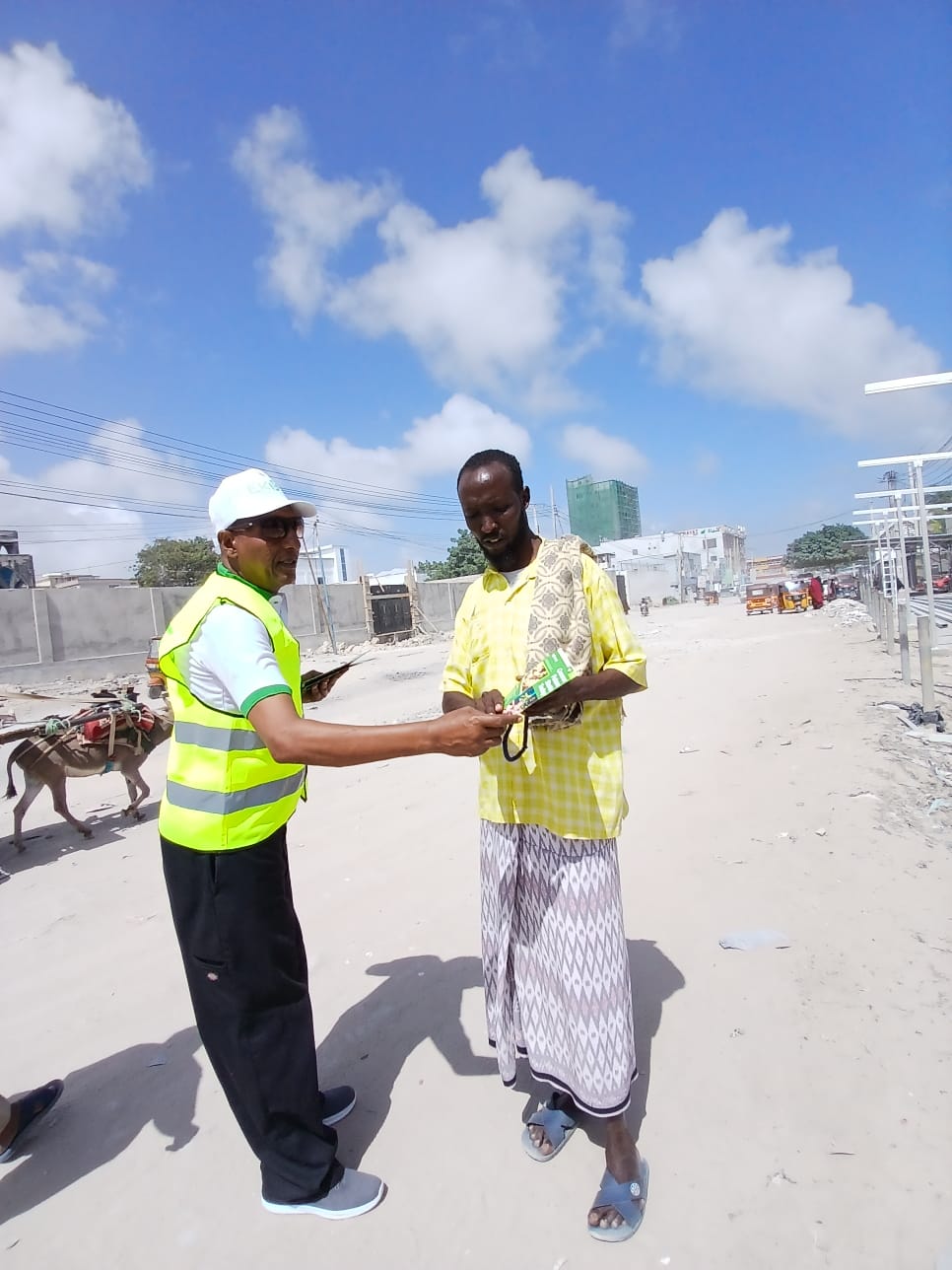 Ekos ry giving out letters to locals about the importance of plants.